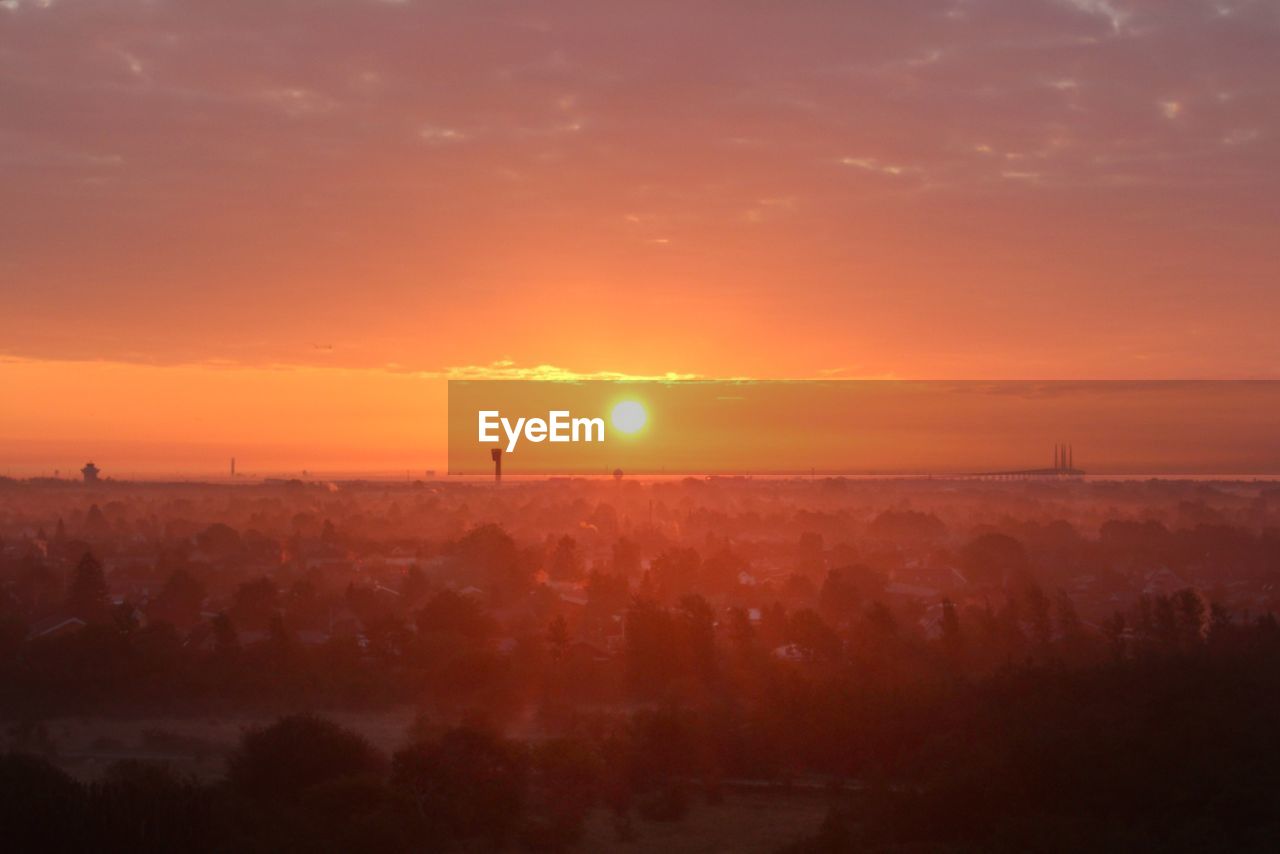 SCENIC VIEW OF SUNSET OVER LANDSCAPE