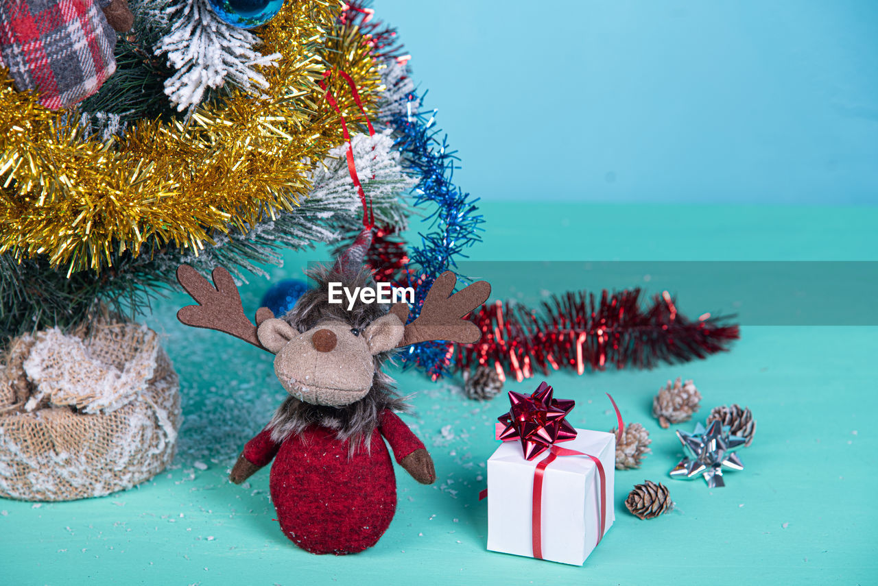 Close-up of christmas tree on blue background