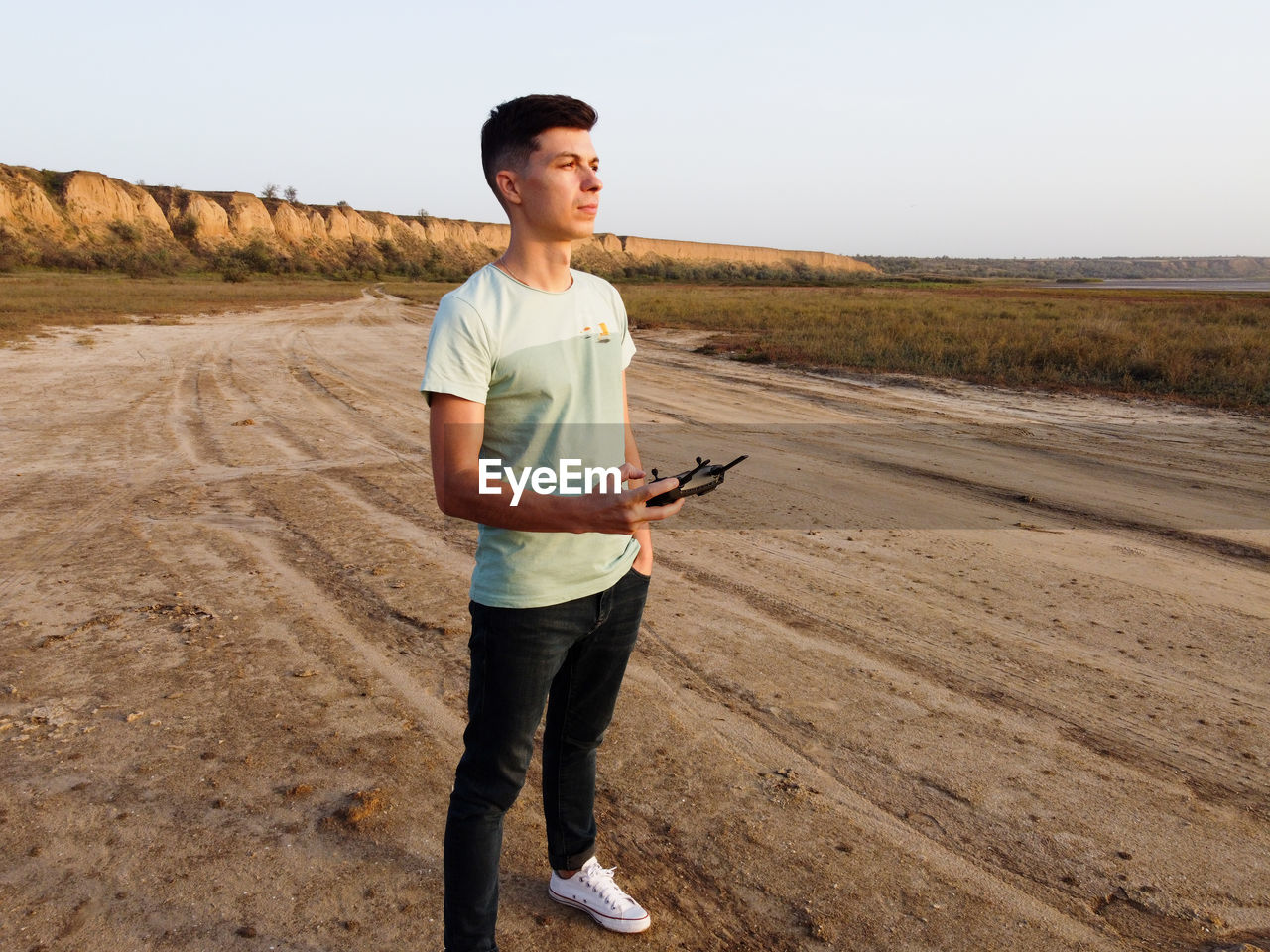 Young man standing on field