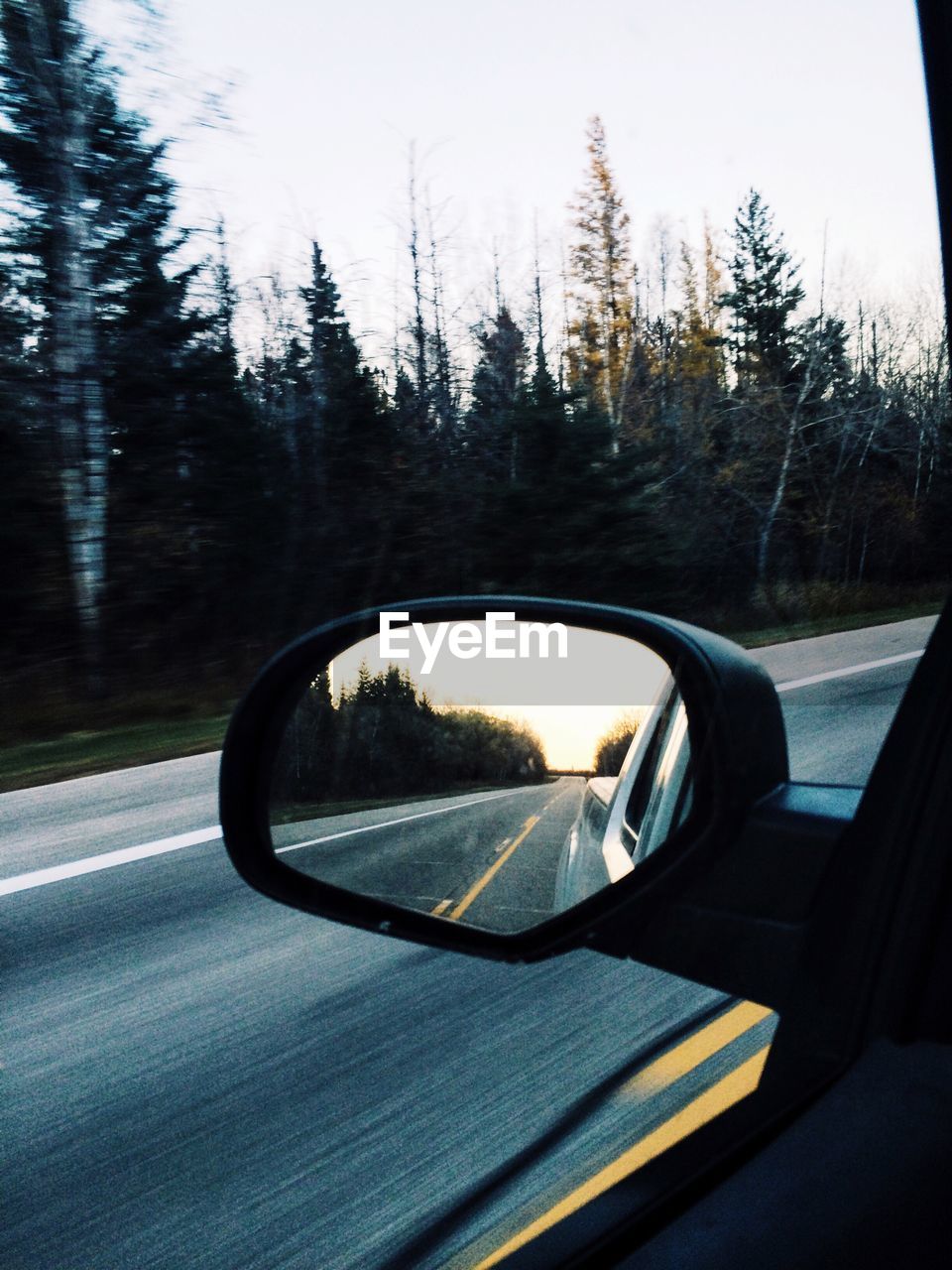 Reflection of road on rear view mirror