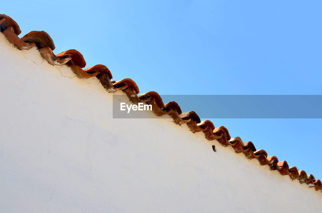 High section of wall against clear sky