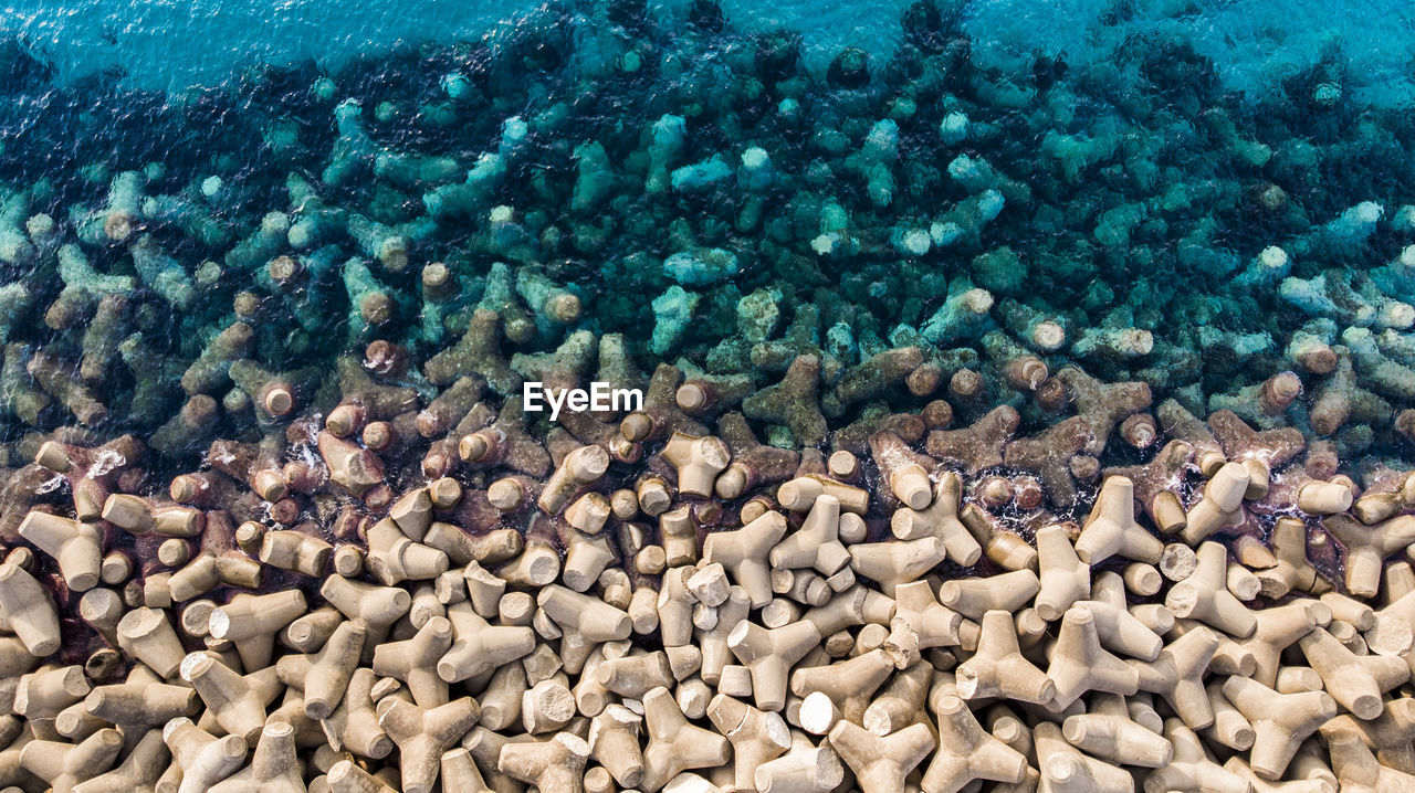 Top down view of wavebreakers protecting the harbour of buggerru.