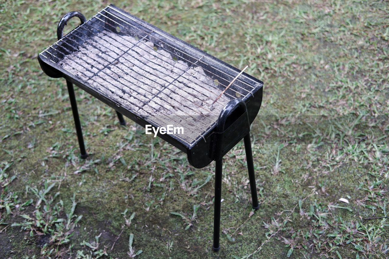 seat, no people, grass, nature, day, plant, high angle view, land, field, empty, wood, absence, bench, furniture, outdoors, chair, abandoned, table