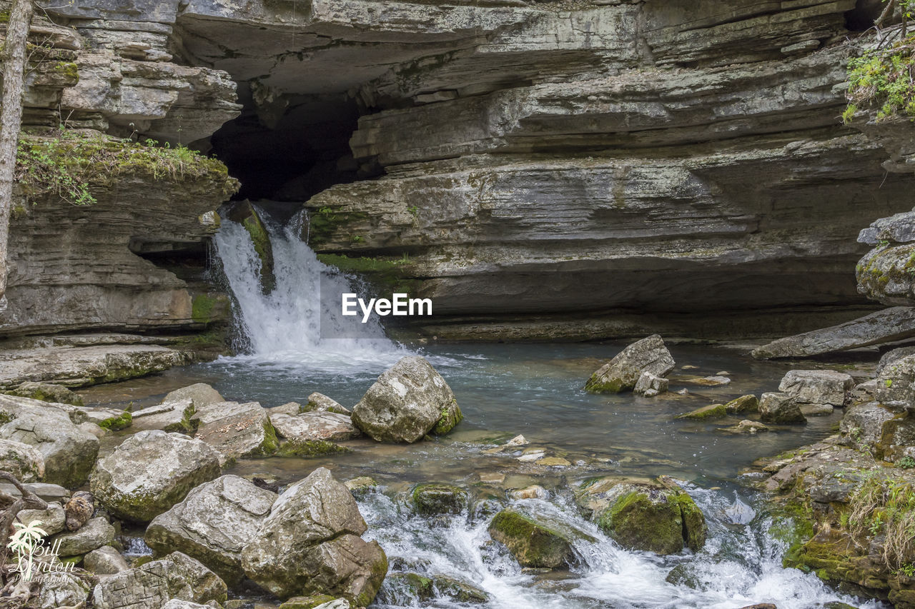 Waterfall amidst rock formation