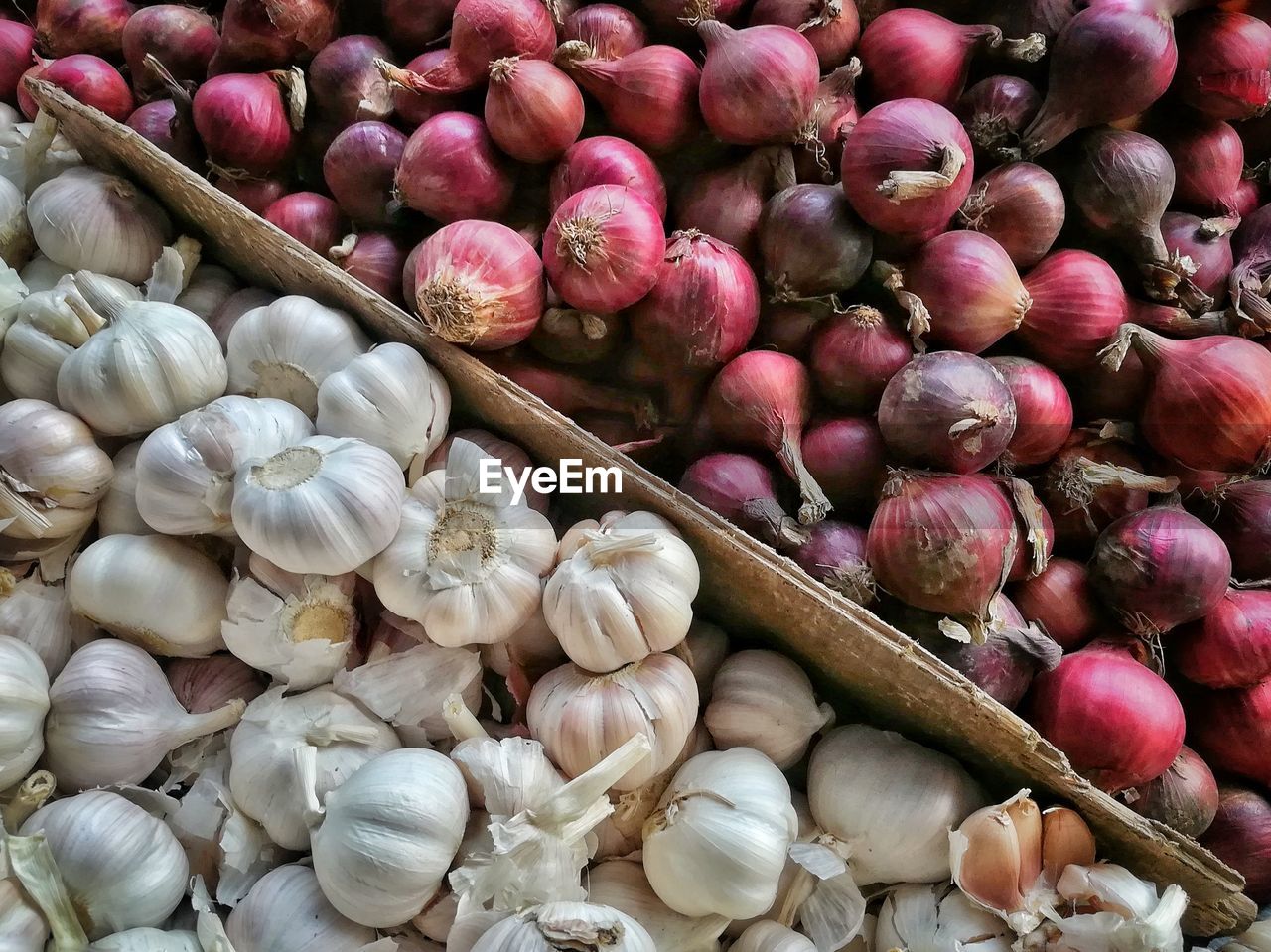 Close-up of garlic and red onions