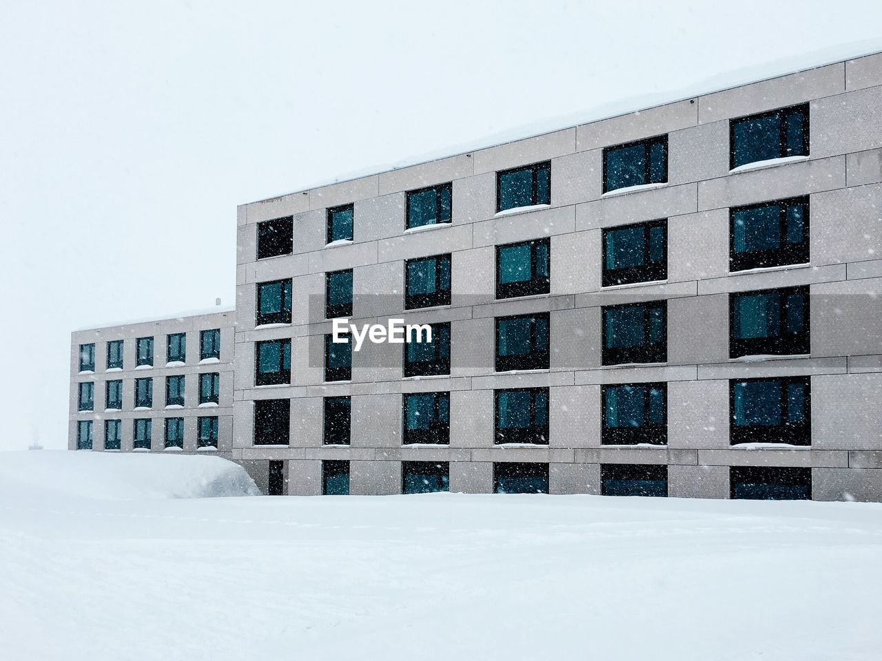 RESIDENTIAL BUILDING AGAINST SKY DURING WINTER