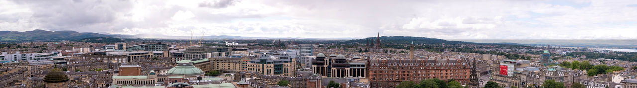 PANORAMIC SHOT OF TOWNSCAPE AGAINST SKY