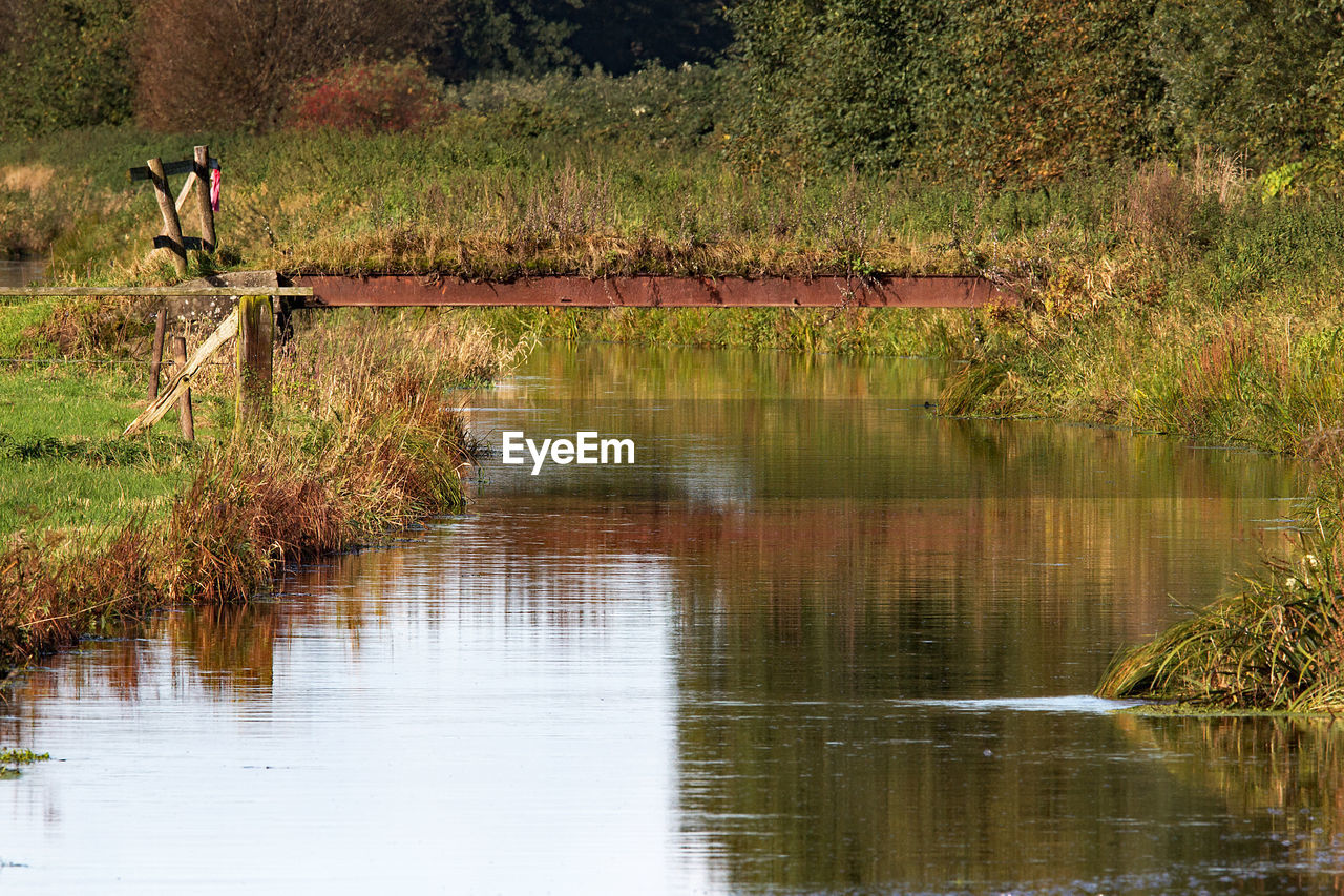 REFLECTION OF MAN ON WATER