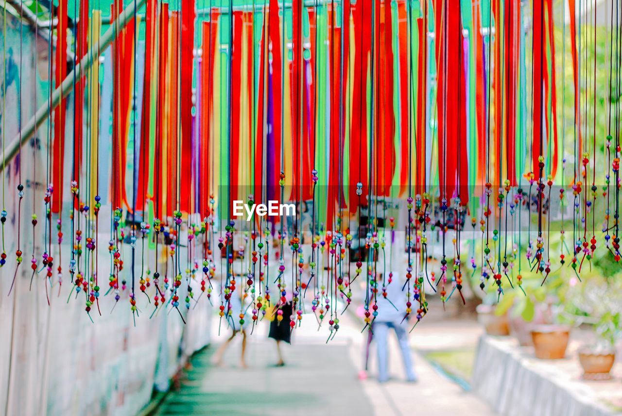 MULTI COLORED UMBRELLAS HANGING ON CEILING