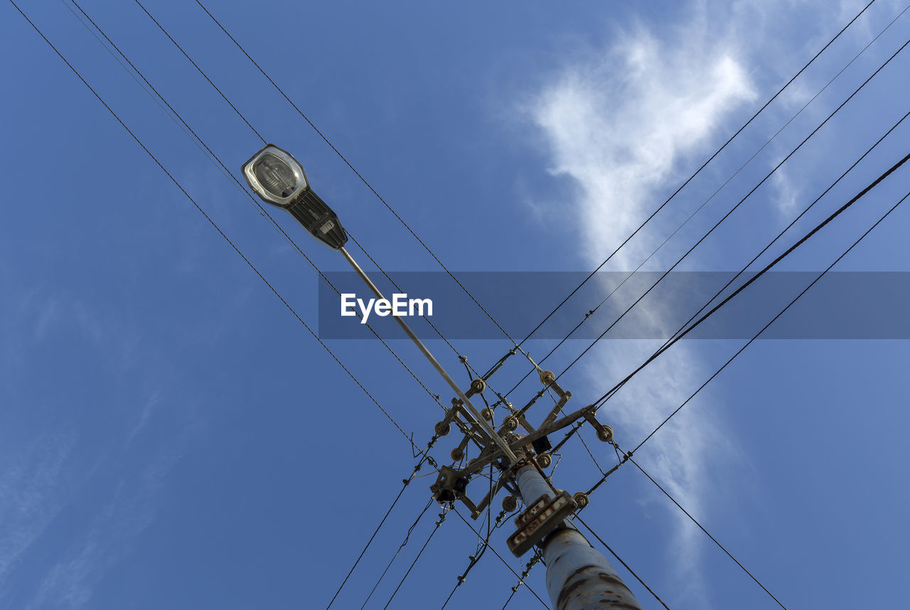 LOW ANGLE VIEW OF POWER LINES AGAINST SKY