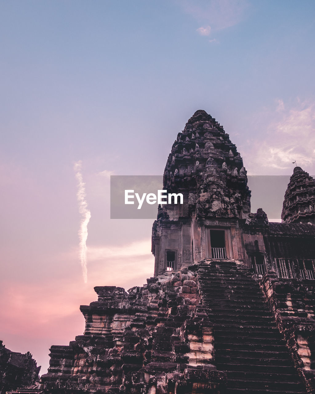 Beautiful temple in cambodia with purple sunrise sky