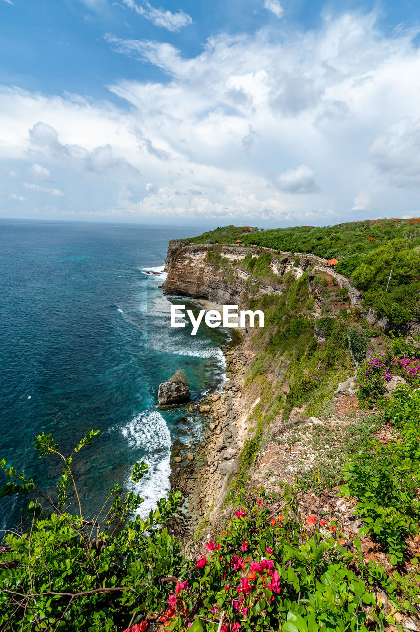 Scenic view of sea against cloudy sky