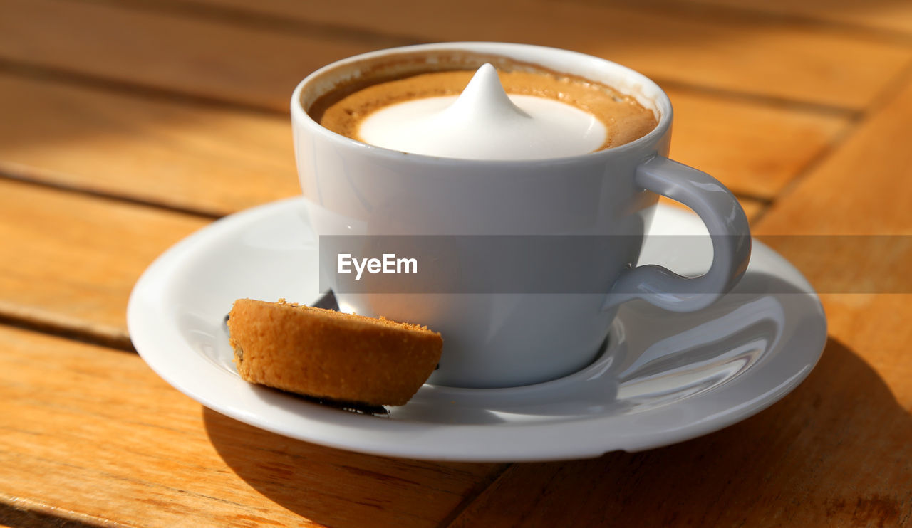 Close-up of coffee cup on table