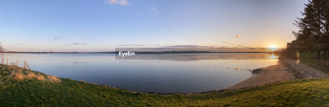 SCENIC VIEW OF SUNSET OVER LAKE