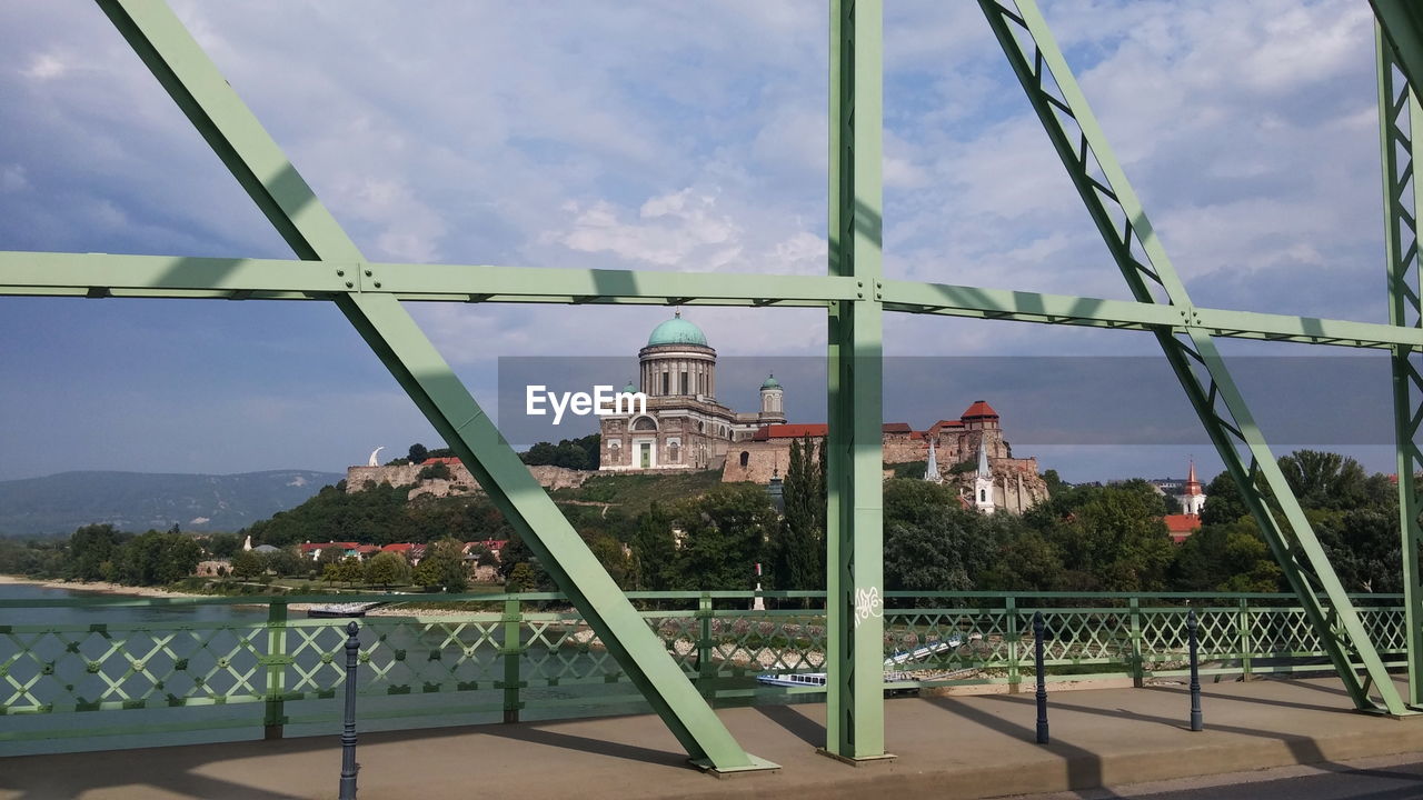 Basilica of esztergom against sky seen from bridge