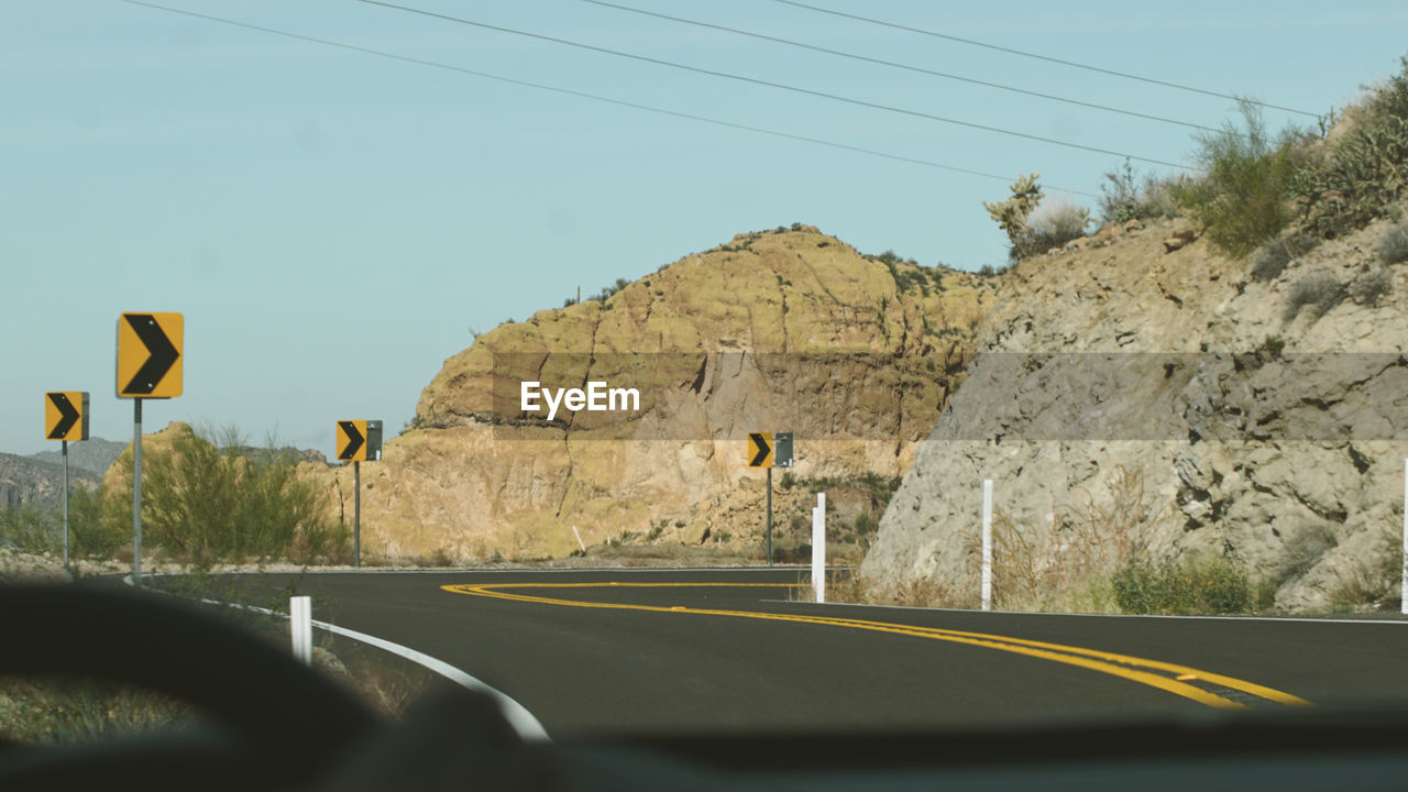 ROAD SEEN THROUGH WINDSHIELD