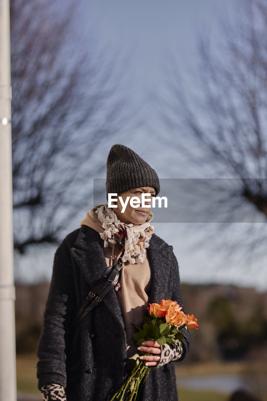 Woman with bunch of roses