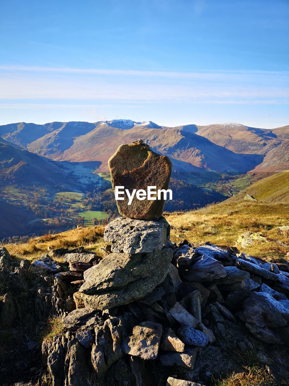 Scenic view of rocks on mountain against sky