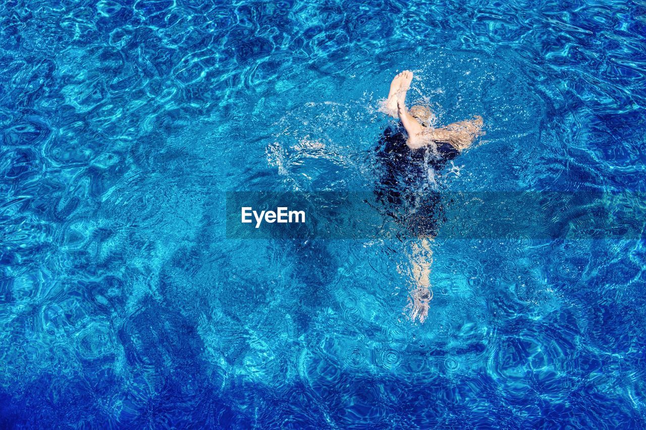 Directly above shot of woman swimming in pool