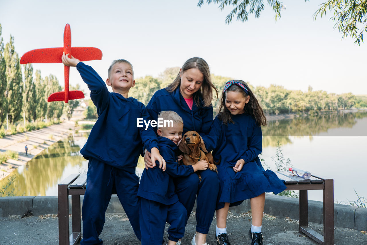 Large family parenting, single mom with large family. single mum and three kids playing together