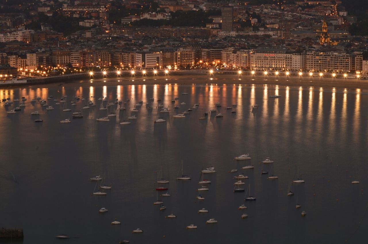 High angle view of illuminated city at night