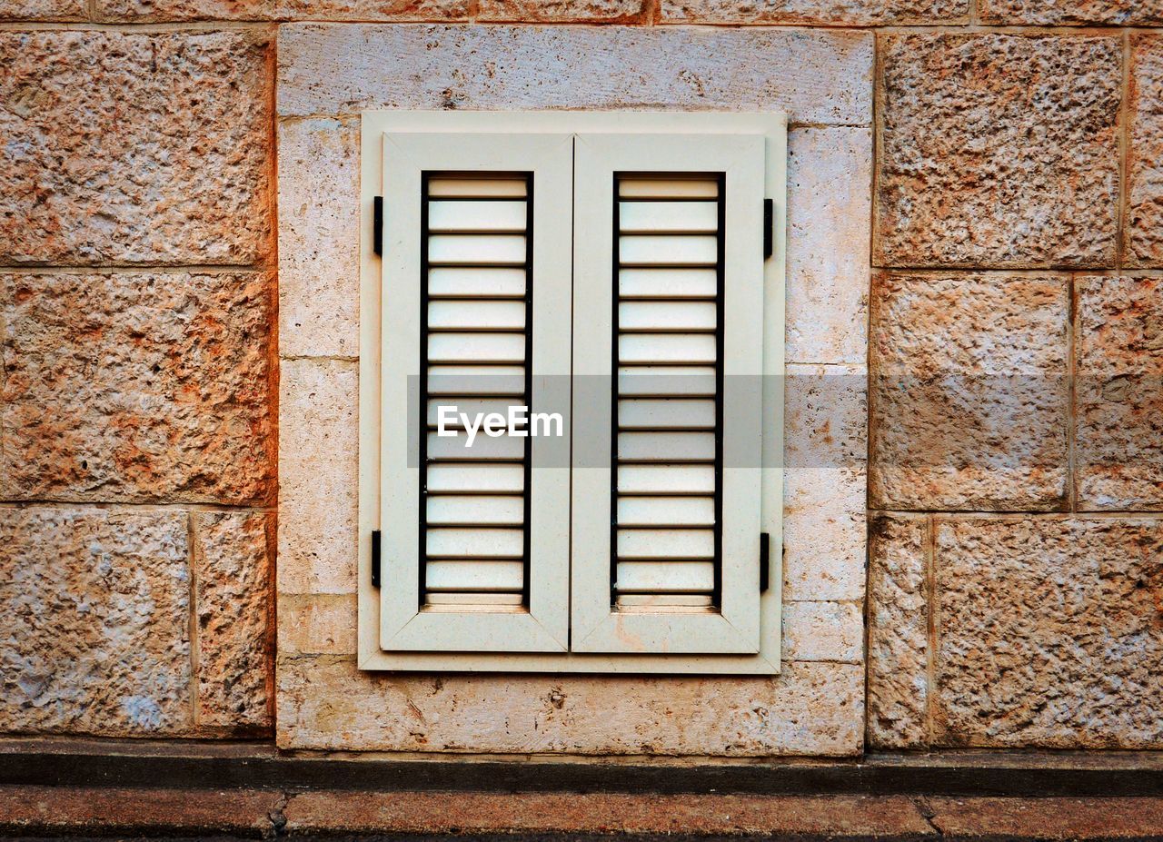 Close-up of window on wall of building