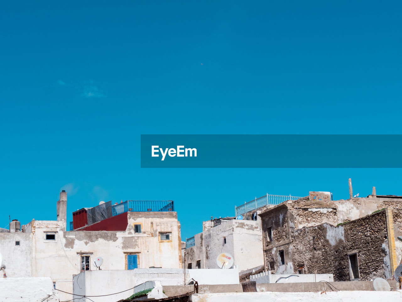 Low angle view of buildings against blue sky