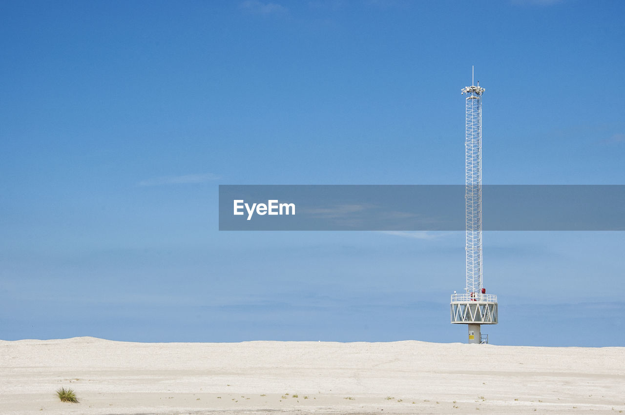 Communication tower on beach