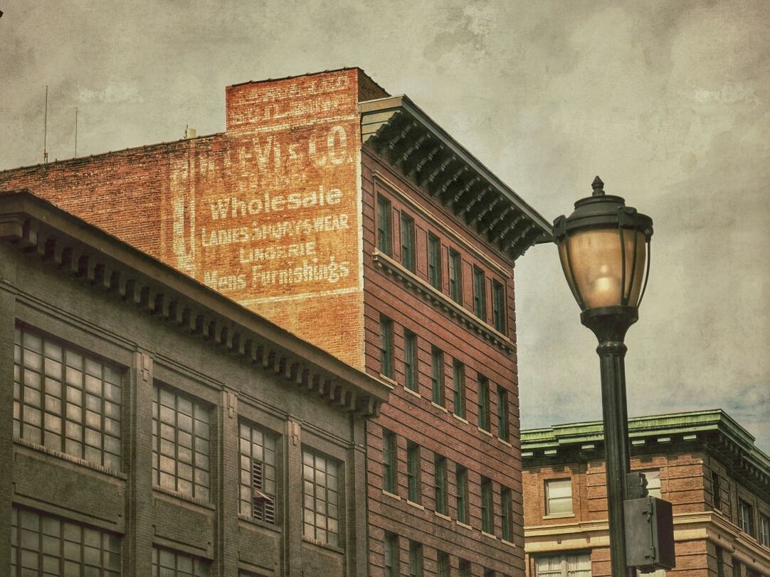 LOW ANGLE VIEW OF BUILDING WITH STREET LIGHT