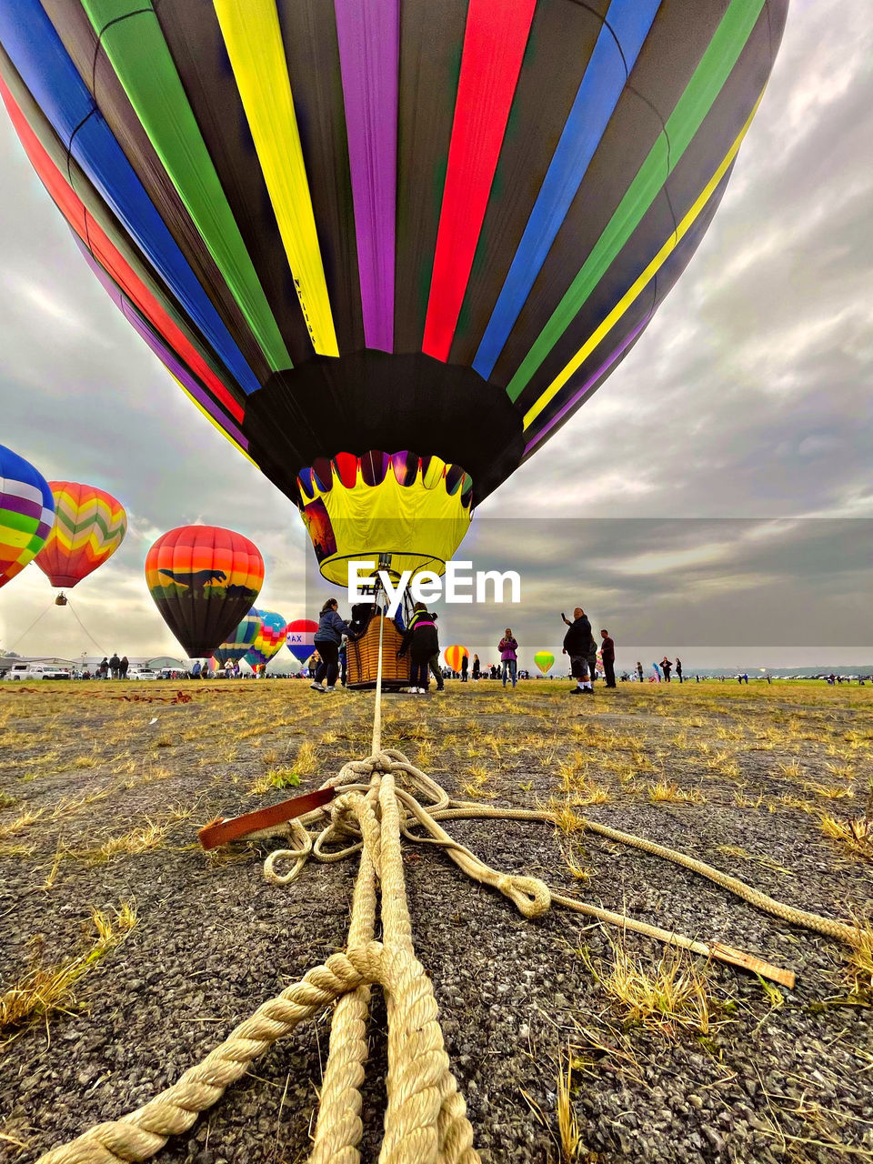 Multi colored hot air balloon flying against sky