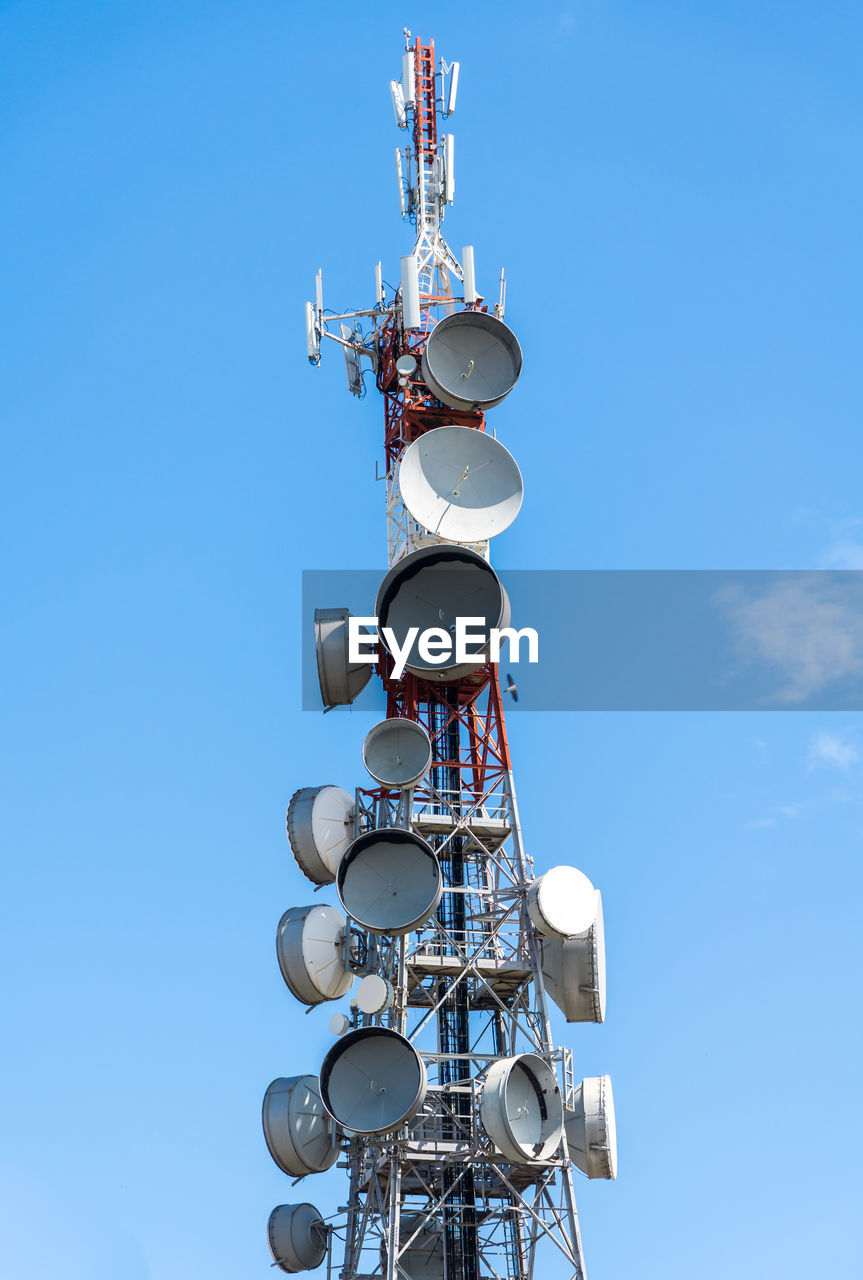 Broadcast and telecomunication antenna on blue sky