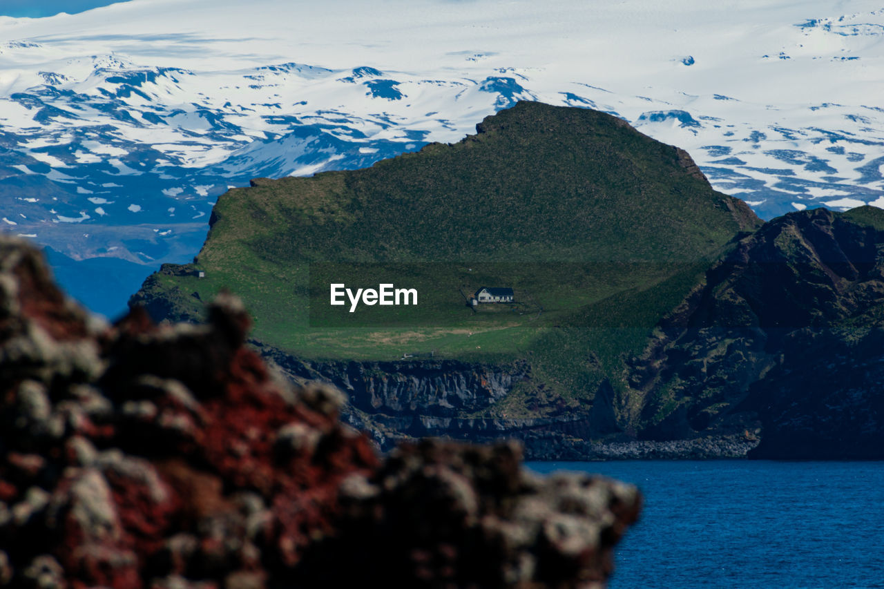 SCENIC VIEW OF SEA AND MOUNTAIN