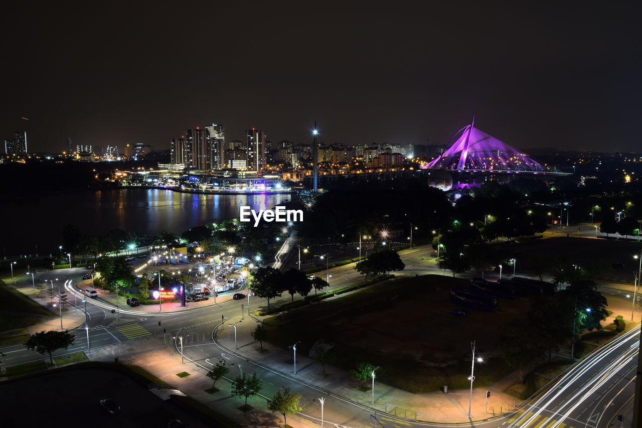 HIGH ANGLE VIEW OF ILLUMINATED CITY BUILDINGS