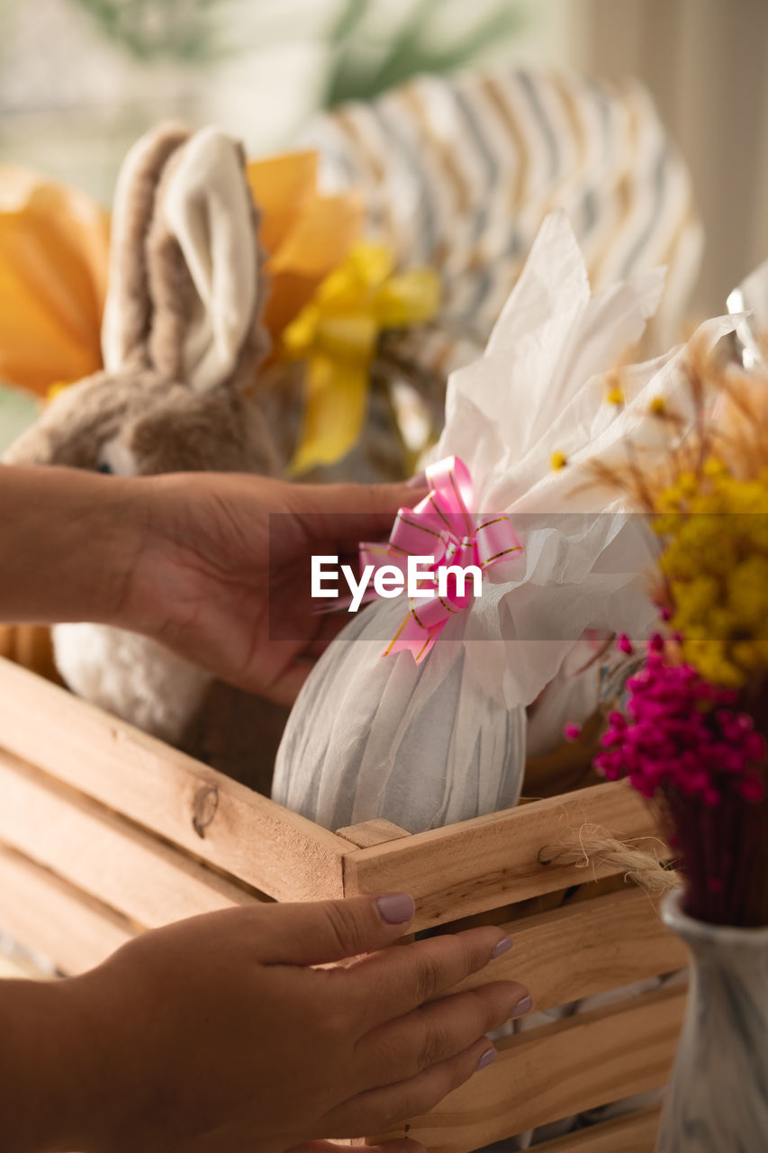 flower, flowering plant, hand, plant, adult, one person, spring, nature, holding, yellow, women, close-up, celebration, beauty in nature, freshness, flower arrangement, indoors, selective focus, bouquet, focus on foreground, lifestyles, decoration, basket, art