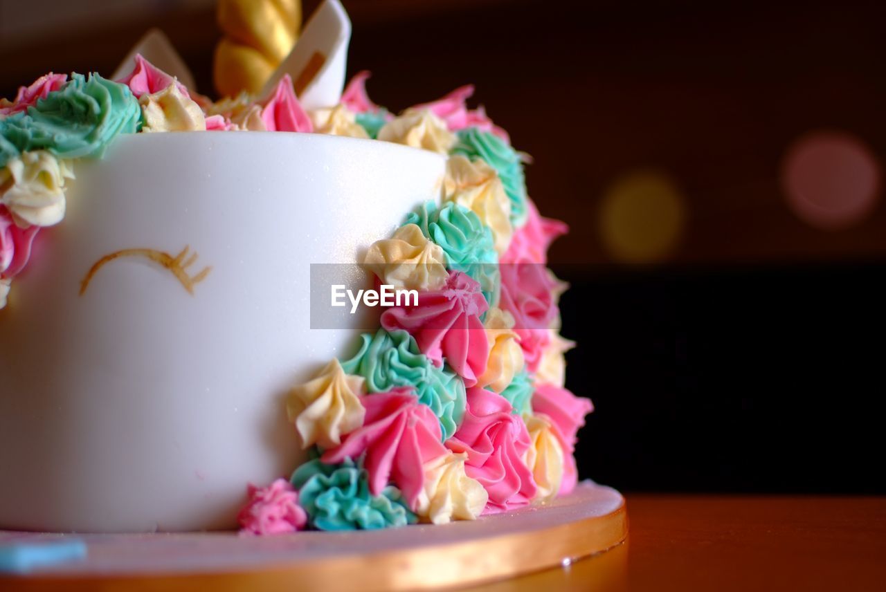 CLOSE-UP OF MULTI COLORED CAKE