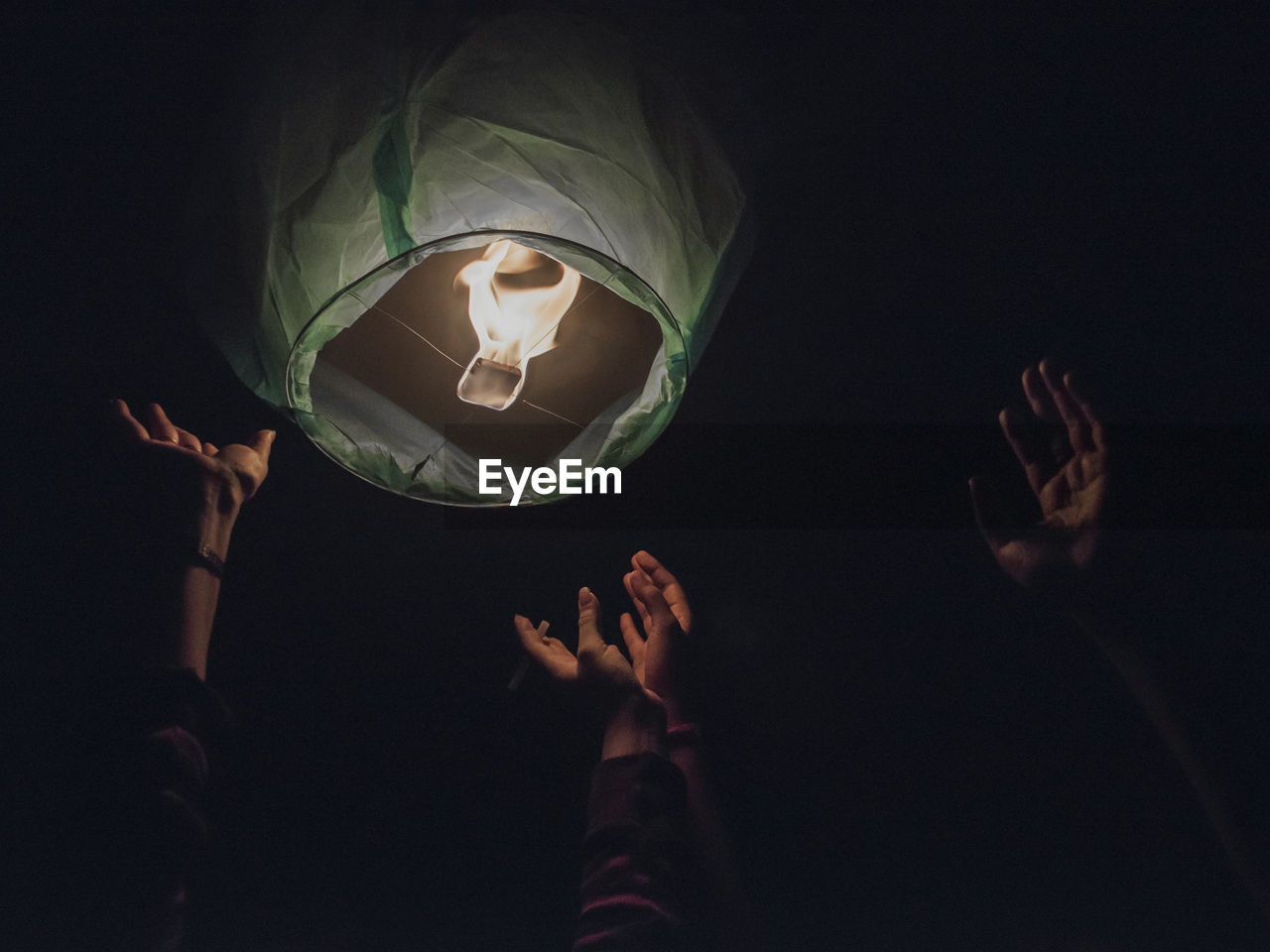 Low angle view of burning lantern mid-air