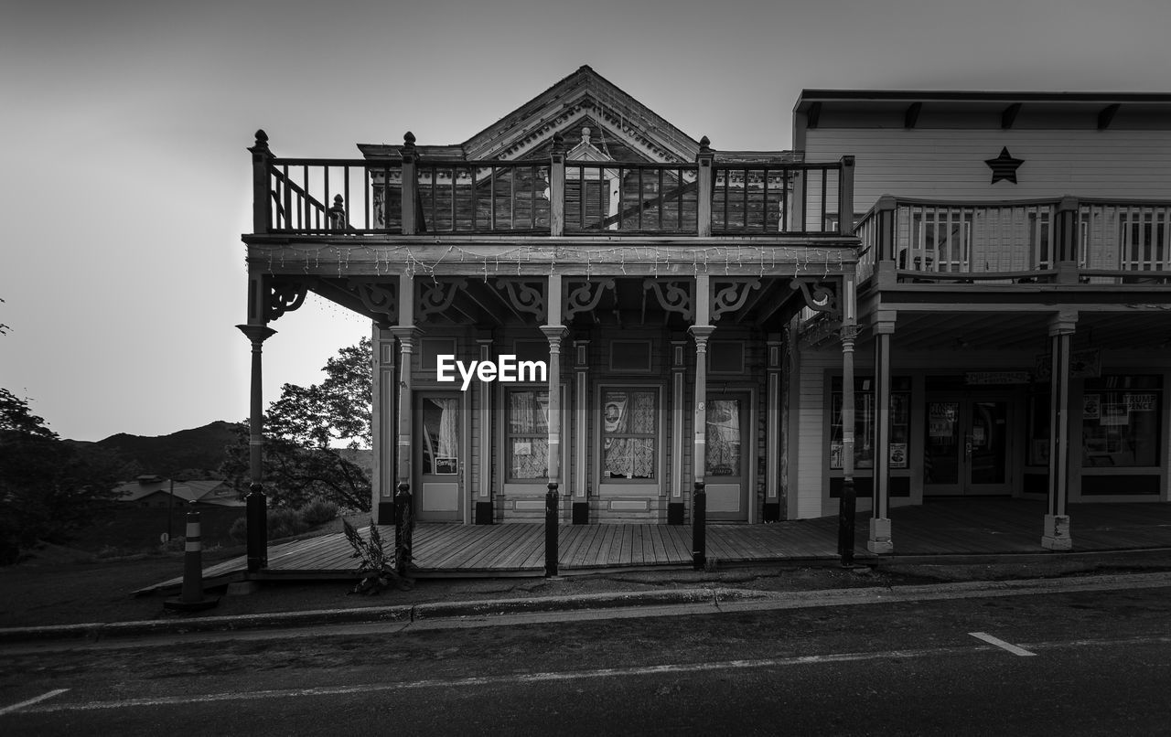 VIEW OF BUILDING WITH ROAD SIGN