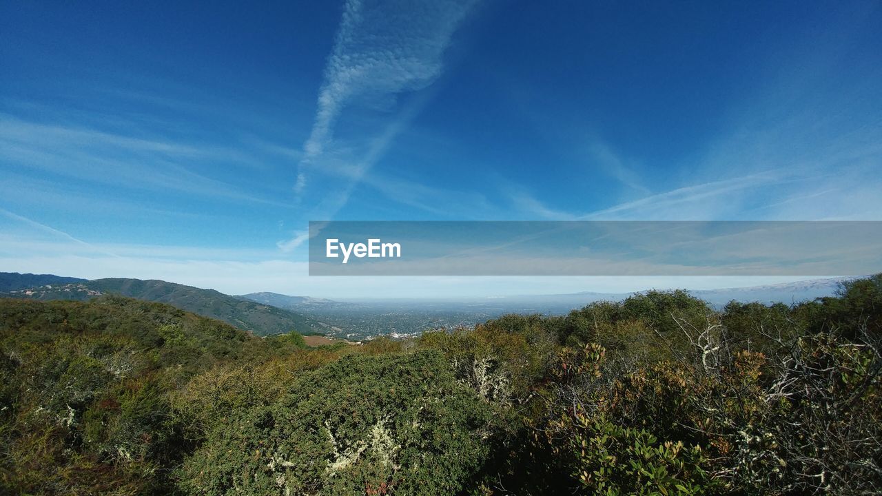 View of countryside landscape against blue sky