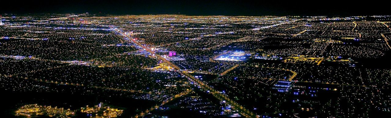 Aerial view of illuminated cityscape at night