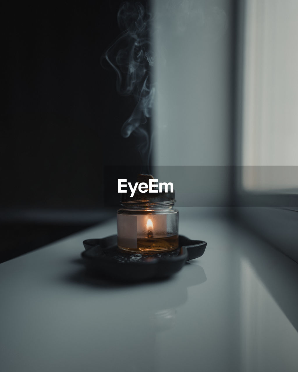 burning, light, smoke, fire, flame, indoors, candle, lighting, darkness, heat, black, no people, table, white, nature, incense, close-up, still life photography, illuminated, dark, still life, steam