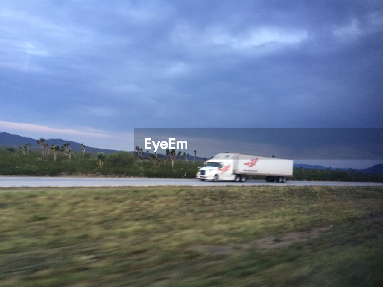 VIEW OF LANDSCAPE AGAINST CLOUDY SKY