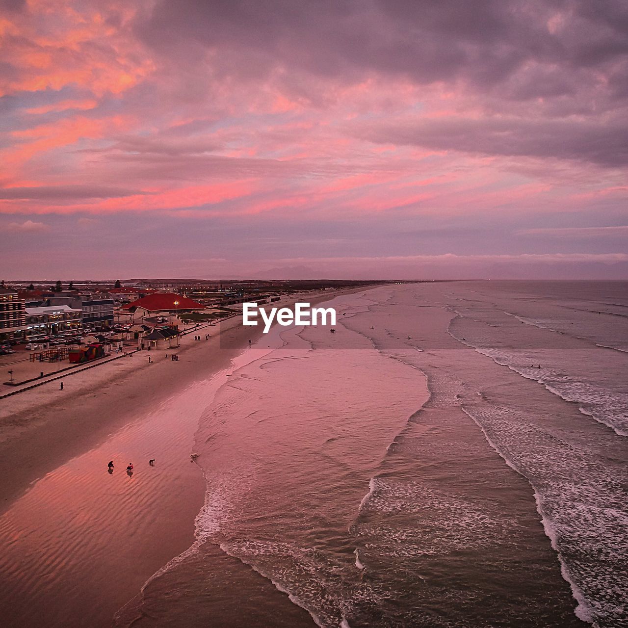 SCENIC VIEW OF BEACH DURING SUNSET