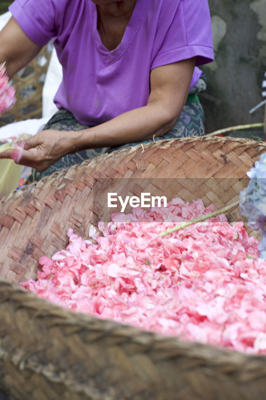 CLOSE-UP OF MAN WORKING IN BASKET