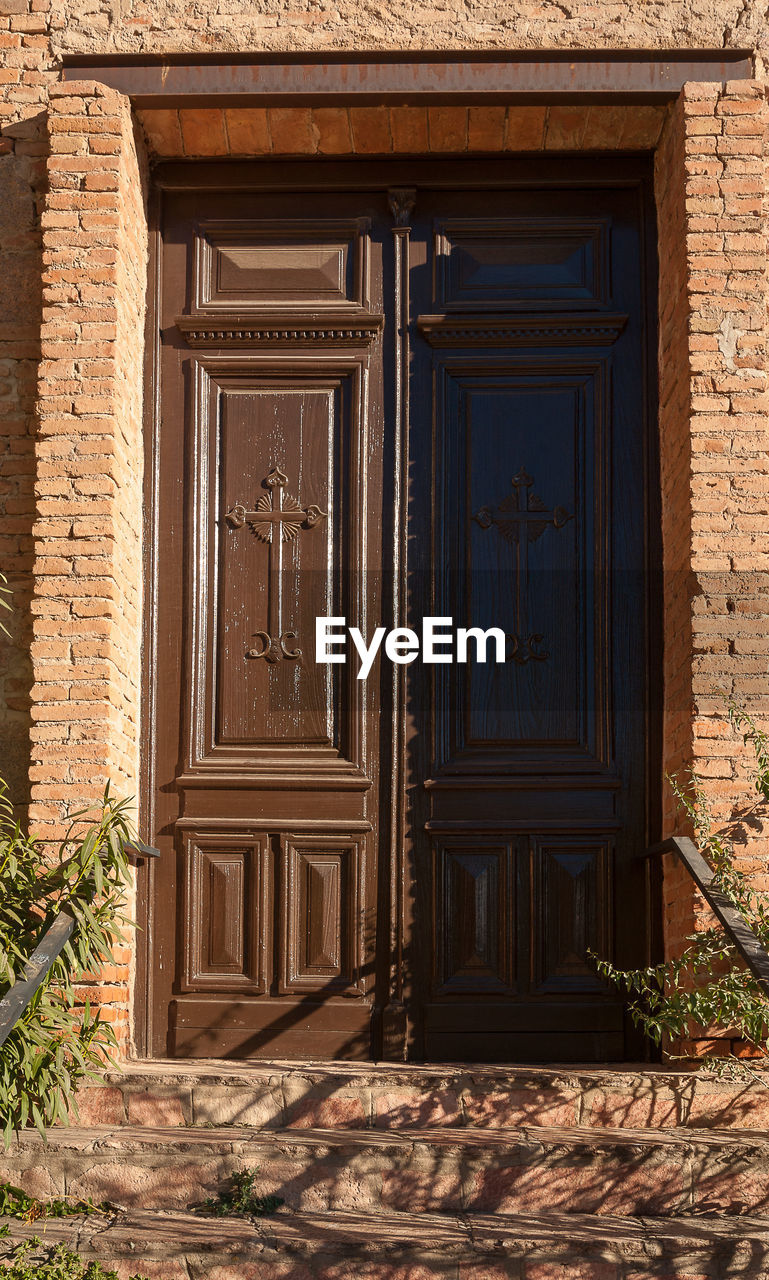 Exterior of house with closed door during sunny day