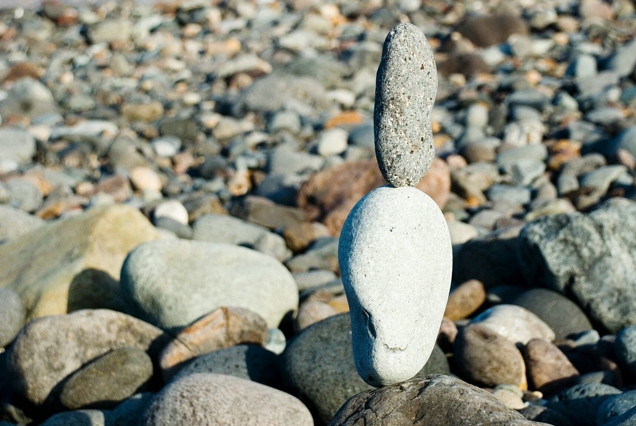 Stacked pebbles at rocky beach