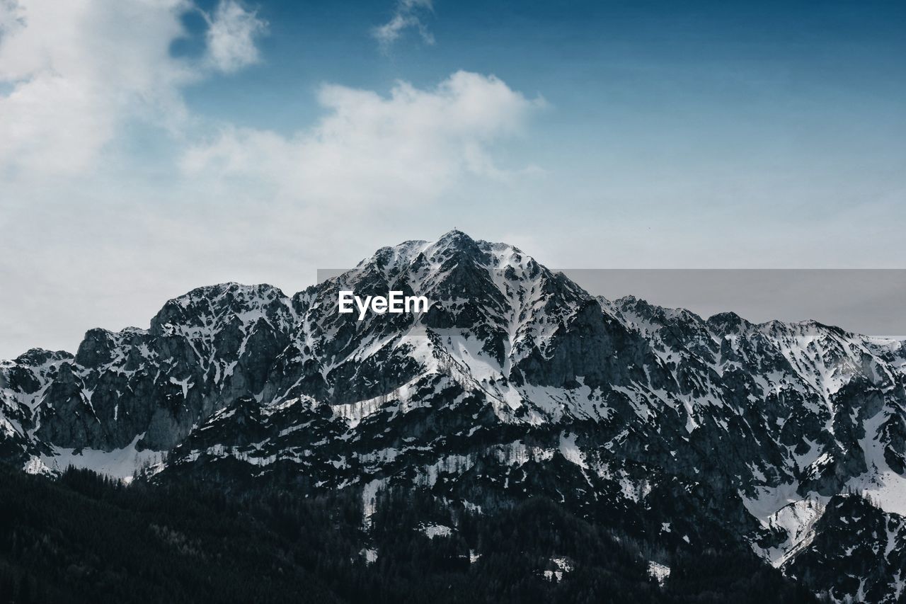 Scenic view of snowcapped mountains against sky