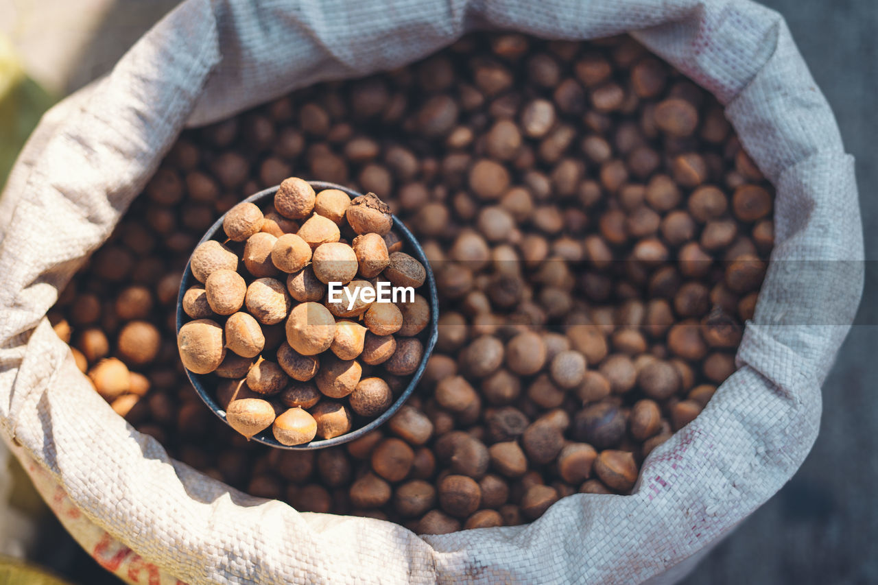 Close-up of grain for sale in sack