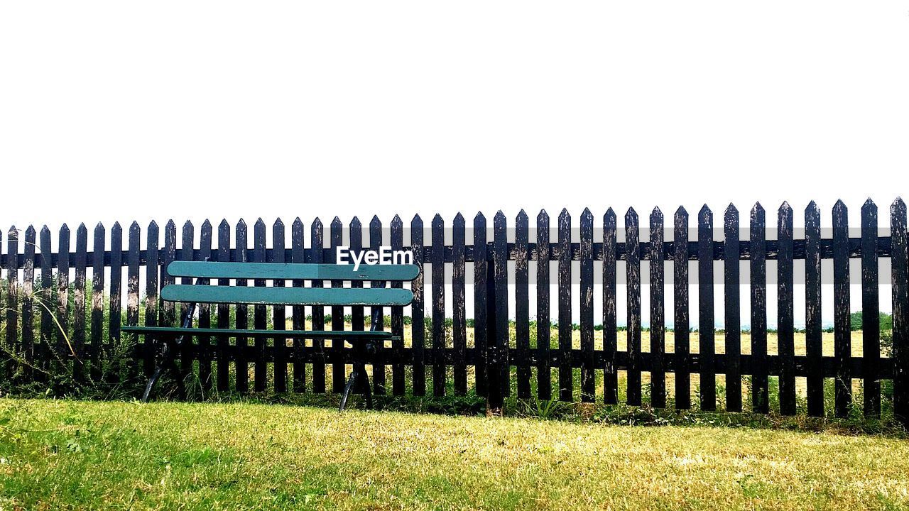 VIEW OF FENCE ON GRASSY FIELD
