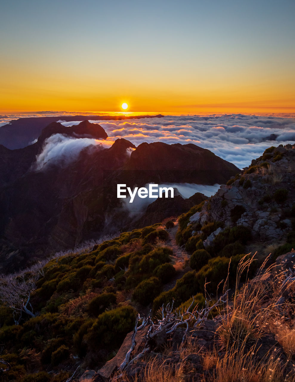 SCENIC VIEW OF MOUNTAIN AGAINST SKY DURING SUNSET