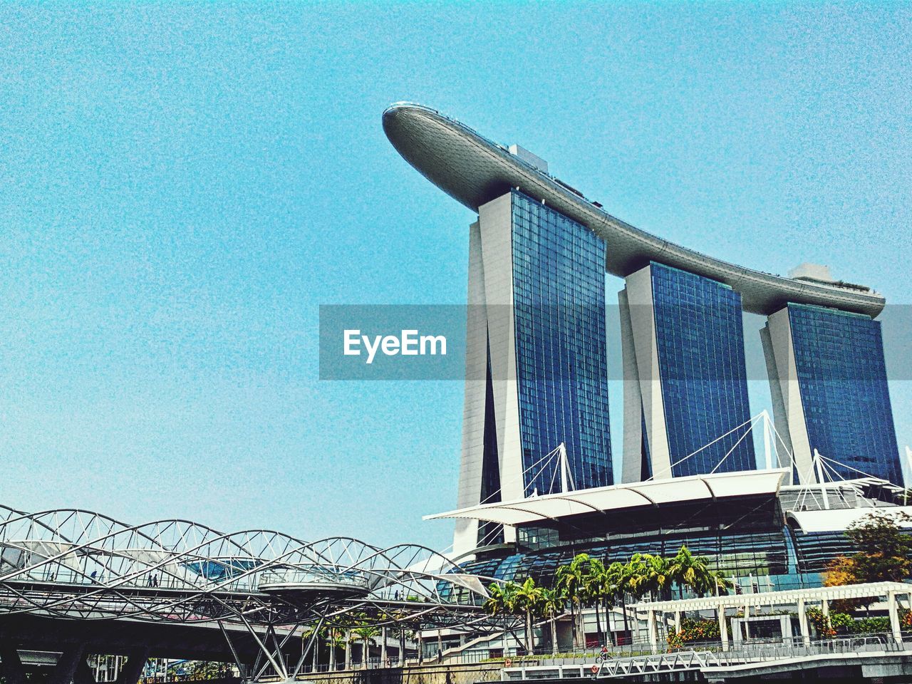 LOW ANGLE VIEW OF BUILT STRUCTURES AGAINST CLEAR BLUE SKY